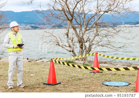 Workers operating drones Workers operating drones 95193787