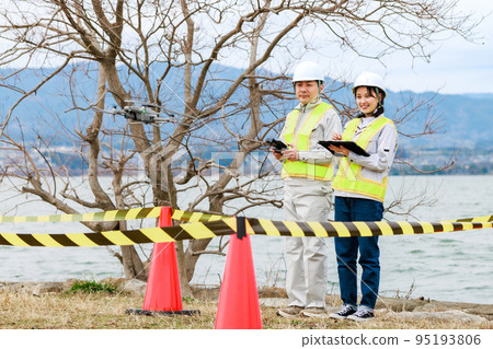 Workers operating drones Workers operating drones 95193806