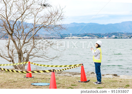 Workers operating drones 95193807