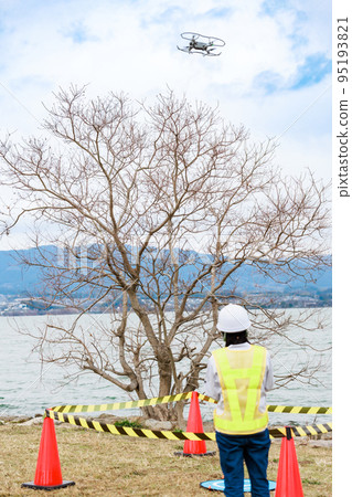 Workers operating drones Workers operating drones 95193821