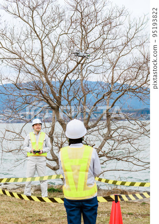 Workers operating drones 95193822