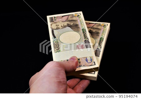Hand with a wad of 2 million yen 1 Hand with a wad of 2 million yen 1 95194074