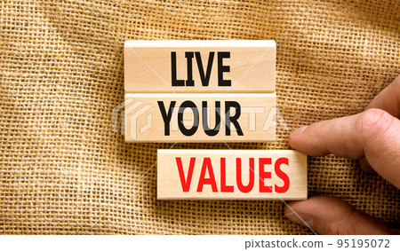 Live your values symbol. Concept words Live your values on wooden blocks. Businessman hand. Beautiful canvas table canvas background. Business, psychological and live your values concept. Copy space. Live your values symbol. Concept words Live your values on wooden blocks. Businessman hand. Beautiful canvas table canvas background. Business, psychological and live your values concept. Copy space. 95195072