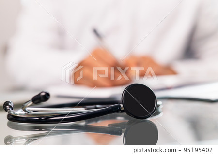 Unrecognizable male doctor In uniform and stethoscope close up Unrecognizable male doctor In uniform and stethoscope close up 95195402