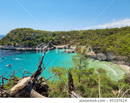 View of turquoise sea in beautiful bay Cala Mitjaneta in Menorca 95197624