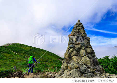 Happo-one second cairn and climbers 95200798