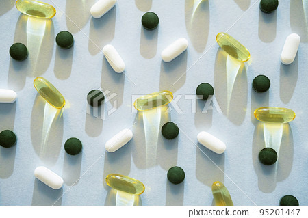 Some pills, vitamin capsules or dietary supplement supports for health. 95201447