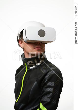Man is using virtual reality headset. Concept of virtual, augmented and extended reality and metaverse. 95203049