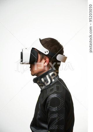 Man is using virtual reality headset. Concept of virtual, augmented and extended reality and metaverse. 95203050