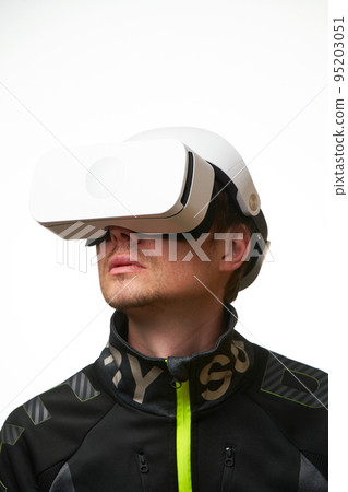 Man is using virtual reality headset. Concept of virtual, augmented and extended reality and metaverse. 95203051