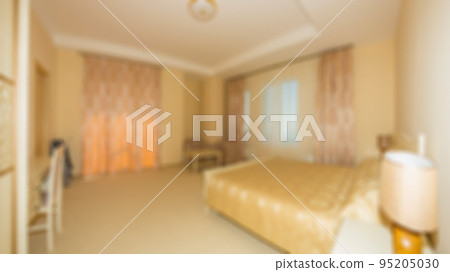 Defocused and blurred photo of luxury and modern bedroom with sea view in hotel apartment interior design. Ideal for background. Defocused and blurred photo of luxury and modern bedroom with sea view in hotel apartment interior design. Ideal for background. 95205030