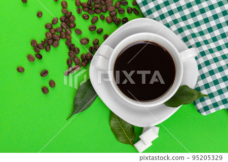 Cup of coffee on green background. Cup of coffee on green background. 95205329