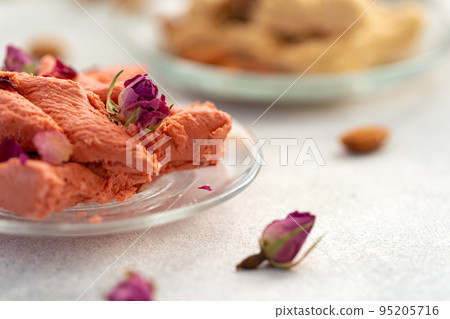 Close up of colorful Turkish halva sweets on gray surface 95205716