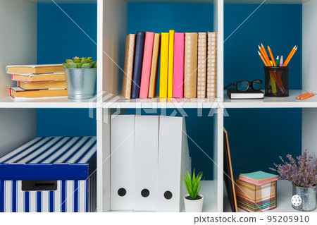 White office shelves with different stationery, close up 95205910