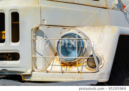 Headlight of an old rusty soviet truck Headlight of an old rusty soviet truck 95205969
