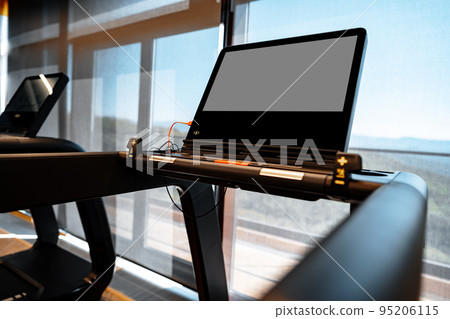 Studio shot of a professional treadmill in modern gym Studio shot of a professional treadmill in modern gym 95206115