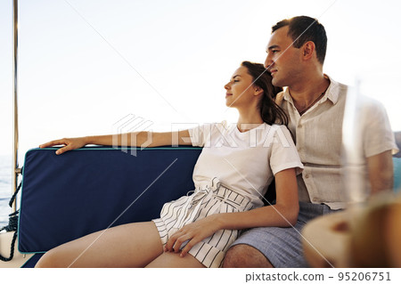 Happy couple on a yacht in summer on romantic vacation 95206751