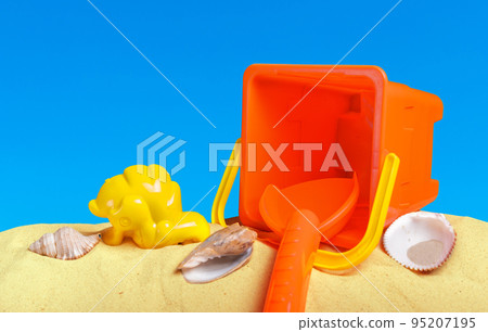 beach toys in the sand close up, beach life beach toys in the sand close up, beach life 95207195