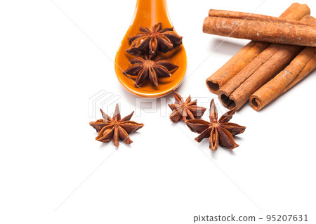 Cinnamon sticks and star anise isolated on white background Cinnamon sticks and star anise isolated on white background 95207631