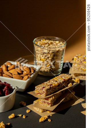 Homemade Granola energy bar. Variety of homemade protein granola breakfast bars ingredients nuts, raisins dried cherries and chocolate. Healthy nutrition eating Gluten free cereal dieting snack super 95208426