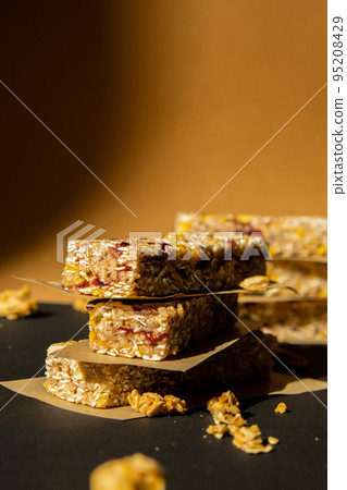 Homemade Granola energy bar. Variety of homemade protein granola breakfast bars, with nuts, raisins dried cherries and chocolate. Healthy nutrition eating Gluten free cereal dieting snack super food 95208429