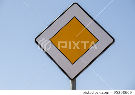 Road sign main road. Speed main road daytime. Road rules International road sign Main road or Priority road against blue sky Road sign main road. Speed main road daytime. Road rules International road sign Main road or Priority road against blue sky 95208669