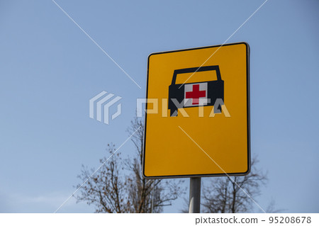 Road sign that shows way for ambulance. Ambulance yellow street sign 95208678