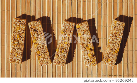 Homemade Granola energy bar. Variety of homemade protein granola breakfast bars, with nuts, raisins dried cherries and chocolate. Healthy nutrition eating Gluten free cereal dieting snack super food 95209243