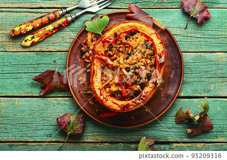 Autumn pumpkin roasted with vegetables. 95209316