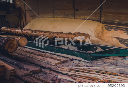 Sawmill. Process of machining logs in equipment sawmill machine saw saws the tree trunk on the plank boards. Wood sawdust work sawing timber wood wooden woodworking Sawmill. Process of machining logs in equipment sawmill machine saw saws the tree trunk on the plank boards. Wood sawdust work sawing timber wood wooden woodworking 95209893