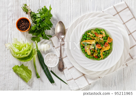 petits pois, french dish of garden green peas 95211965