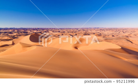Sunset view to Tin Merzouga dune at Tassili nAjjer national park in Algeria 95211996