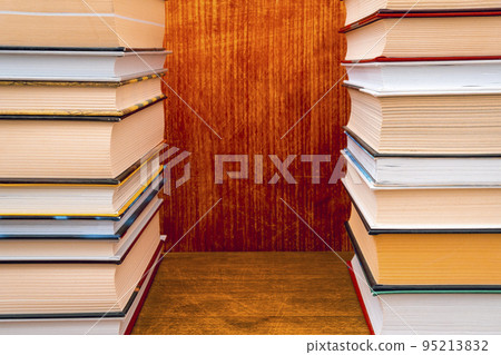Hardback books on the bookshelf, copy-space Hardback books on the bookshelf, copy-space 95213832