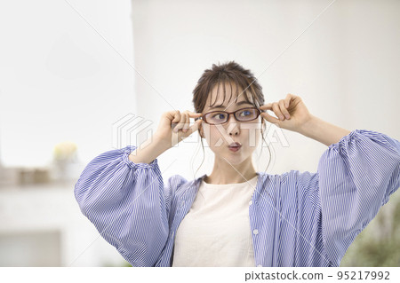 young woman wearing glasses young woman wearing glasses 95217992