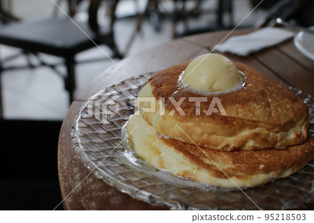 Table with fluffy pancakes with butter Table with fluffy pancakes with butter 95218503