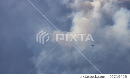 BC Forest Fire and Smoke over the mountain near Hope during a hot sunny summer day. BC Forest Fire and Smoke over the mountain near Hope during a hot sunny summer day. 95219426