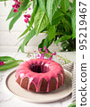 Fresh homemade chocolate bundt cake decorated with pink glaze 95219467