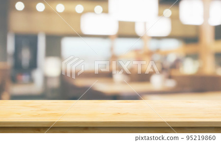 Empty wood table top with cafe restaurant interior blurred background Empty wood table top with cafe restaurant interior blurred background 95219860