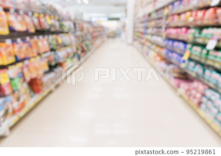 Abstract blur supermarket discount store aisle and product shelves interior defocused background 95219861