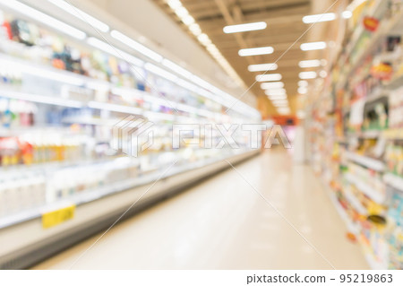 Abstract blur supermarket discount store aisle and product shelves interior defocused background Abstract blur supermarket discount store aisle and product shelves interior defocused background 95219863
