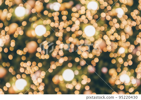 Abstract christmas holiday with festive gold bokeh light on tree blurred background Abstract christmas holiday with festive gold bokeh light on tree blurred background 95220430