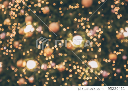 Abstract christmas holiday with festive gold bokeh light on tree blurred background Abstract christmas holiday with festive gold bokeh light on tree blurred background 95220431