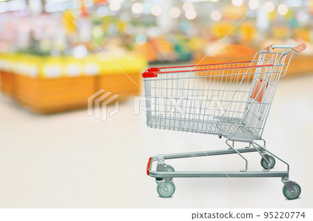 Supermarket grocery store with empty shopping cart 95220774