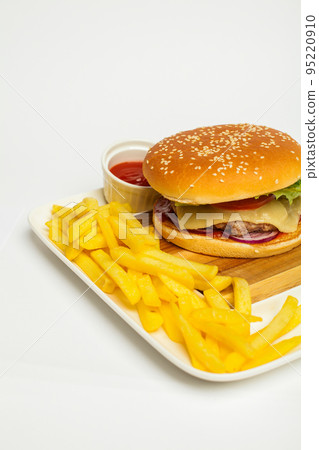 fresh tasty burger and fresh tasty french fries on white background fresh tasty burger and fresh tasty french fries on white background 95220910