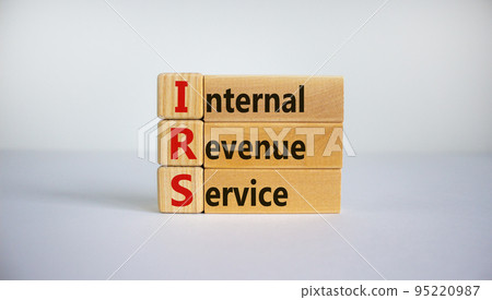 Concept word 'IRS - Internal Revenue Service' on wooden cubes and blocks on a beautiful white background. Business concept, copy space. 95220987