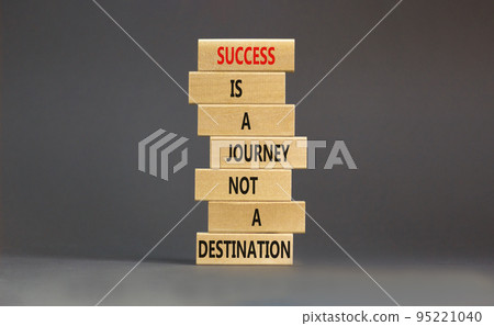 Success is a journey symbol. Concept words Success is a journey not a destination on wooden blocks on a beautiful grey table grey background. Business and success journey concept. Copy space 95221040