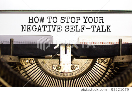 Stop negative self-talk symbol. Concept words How to stop your negative self-talk typed on old retro typewriter. Beautiful white background. Psychological stop negative self-talk concept. Copy space. 95221079