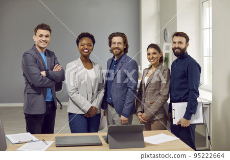 Multiethnic people on board of directors company or corporation stand with smile next to table 95222664
