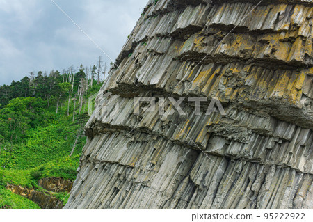 natural background, rock fragment from volcanic lava pillars natural background, rock fragment from volcanic lava pillars 95222922