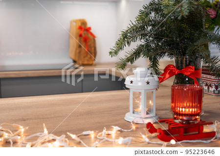 Christmas festively decorated kitchen with christmas lights, and cookie cutters 95223646